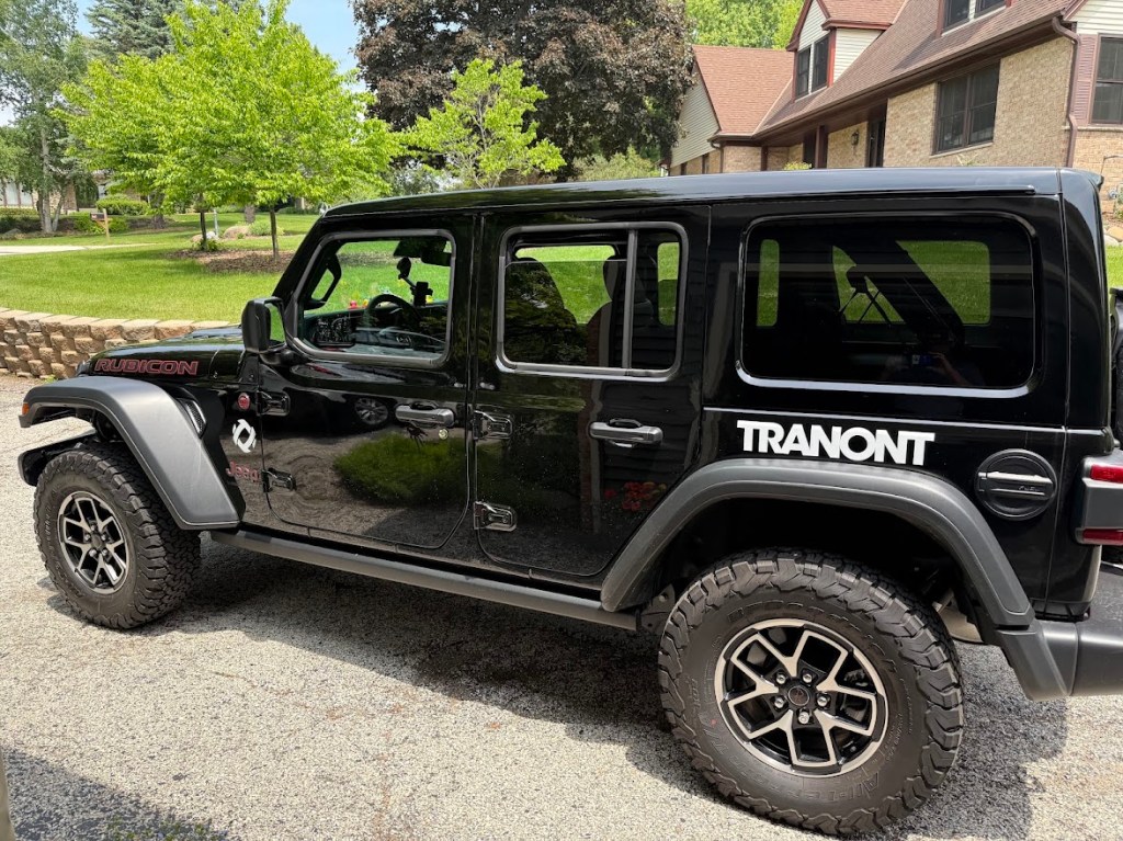 Tranont-branded Jeep Rubicon parked in the driveway