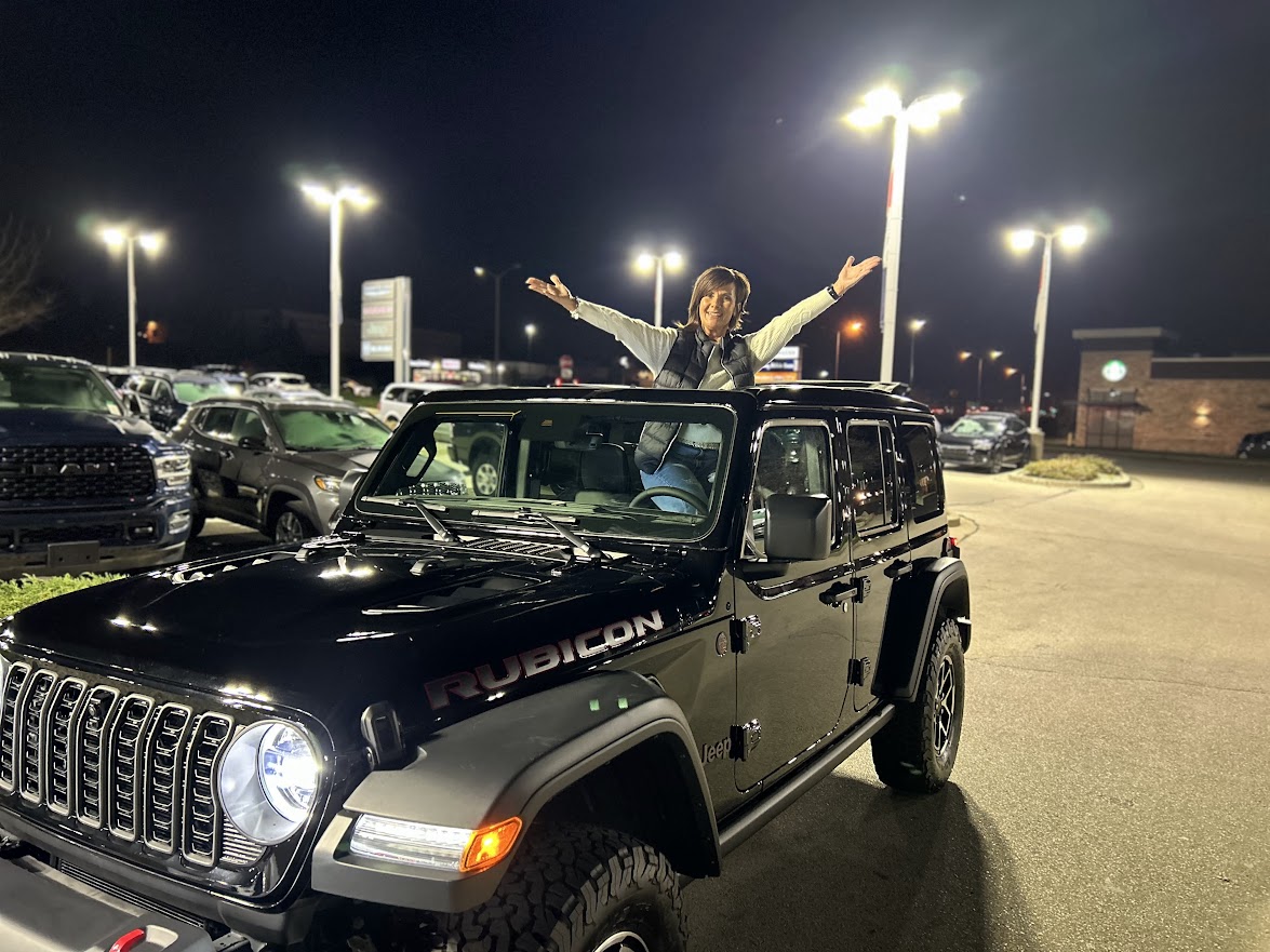 Cheryl Kayzar with the Tranont-branded Jeep Rubicon at night